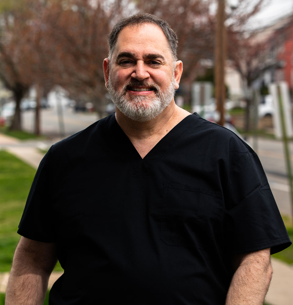 headshot of doctor smiling