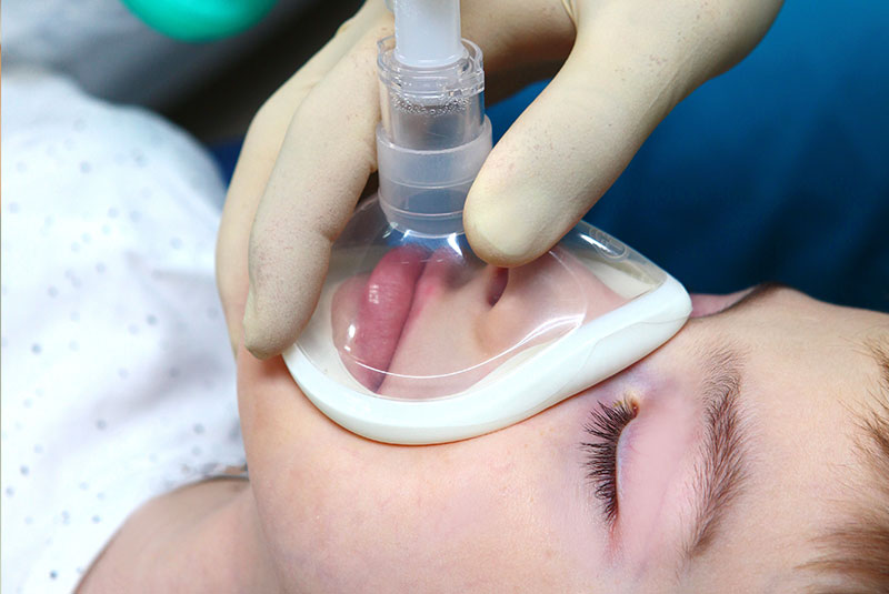 child patient undergoing general anesthesia for dental procedure
