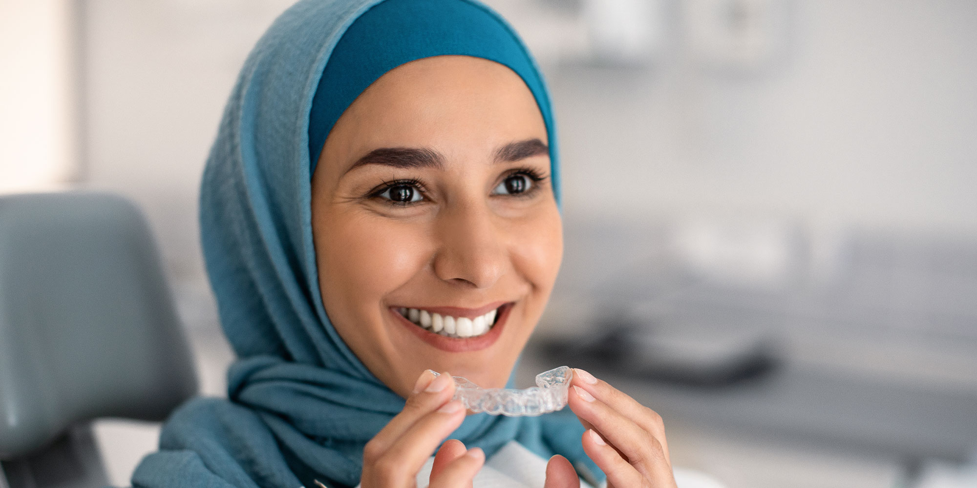 patient trying on Invisalign within the dental center